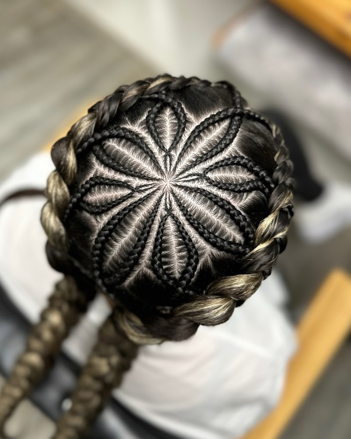 Award winning braided hairstyle by Olga Olikova, seen from above: braids forming a flower on the crown